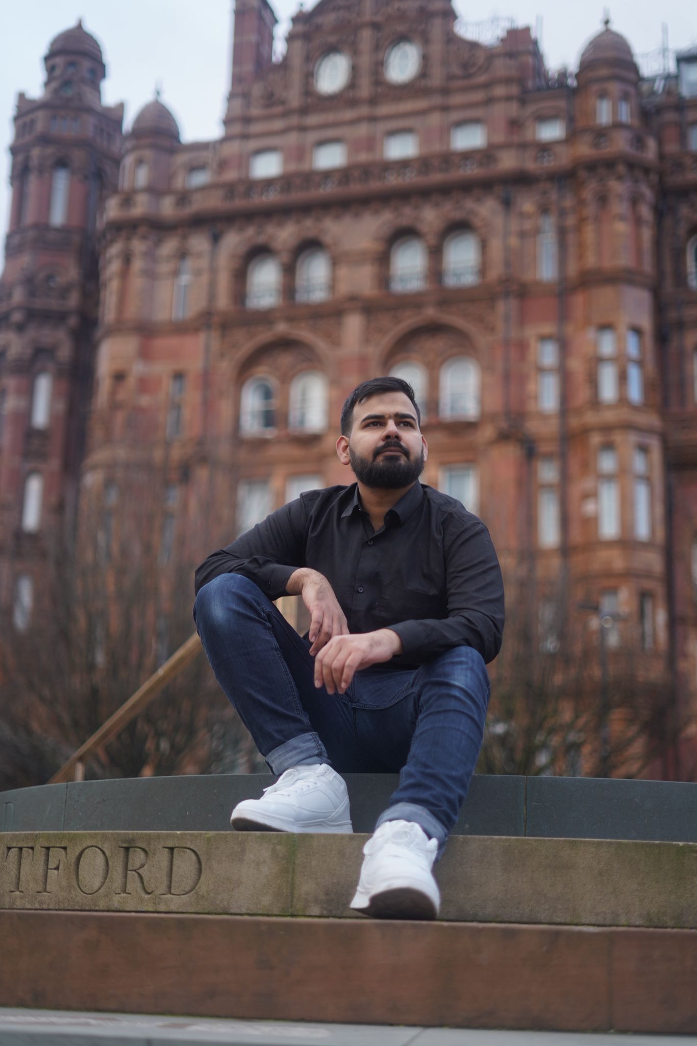 Rizwan Saleem in front of a Manchester old building